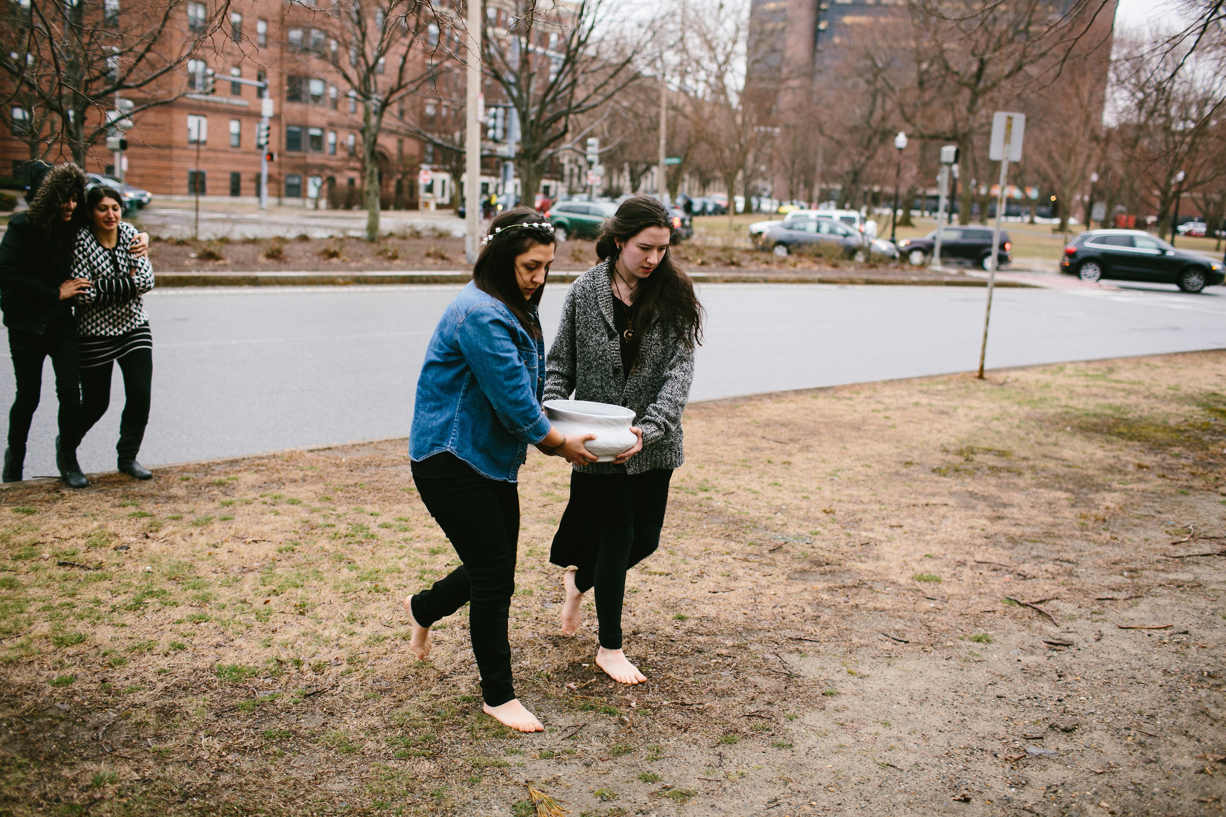 Artists barefoot carrying ritual low bowl through Boston MA Madeleine Kobold photography