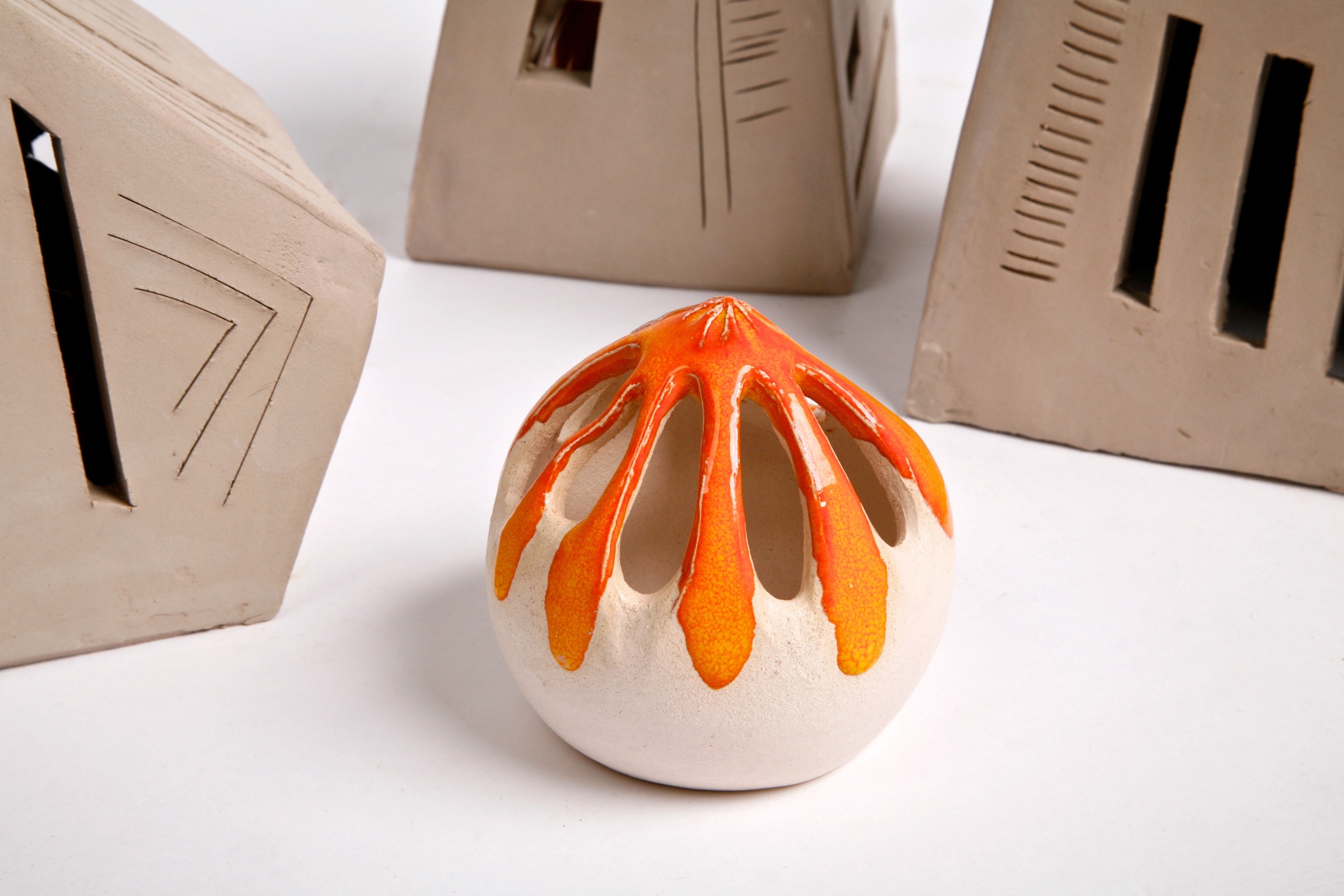 Bright orange round ceramic sculpture at NCAD in Dublin Ireland Shannon May Mackenzie