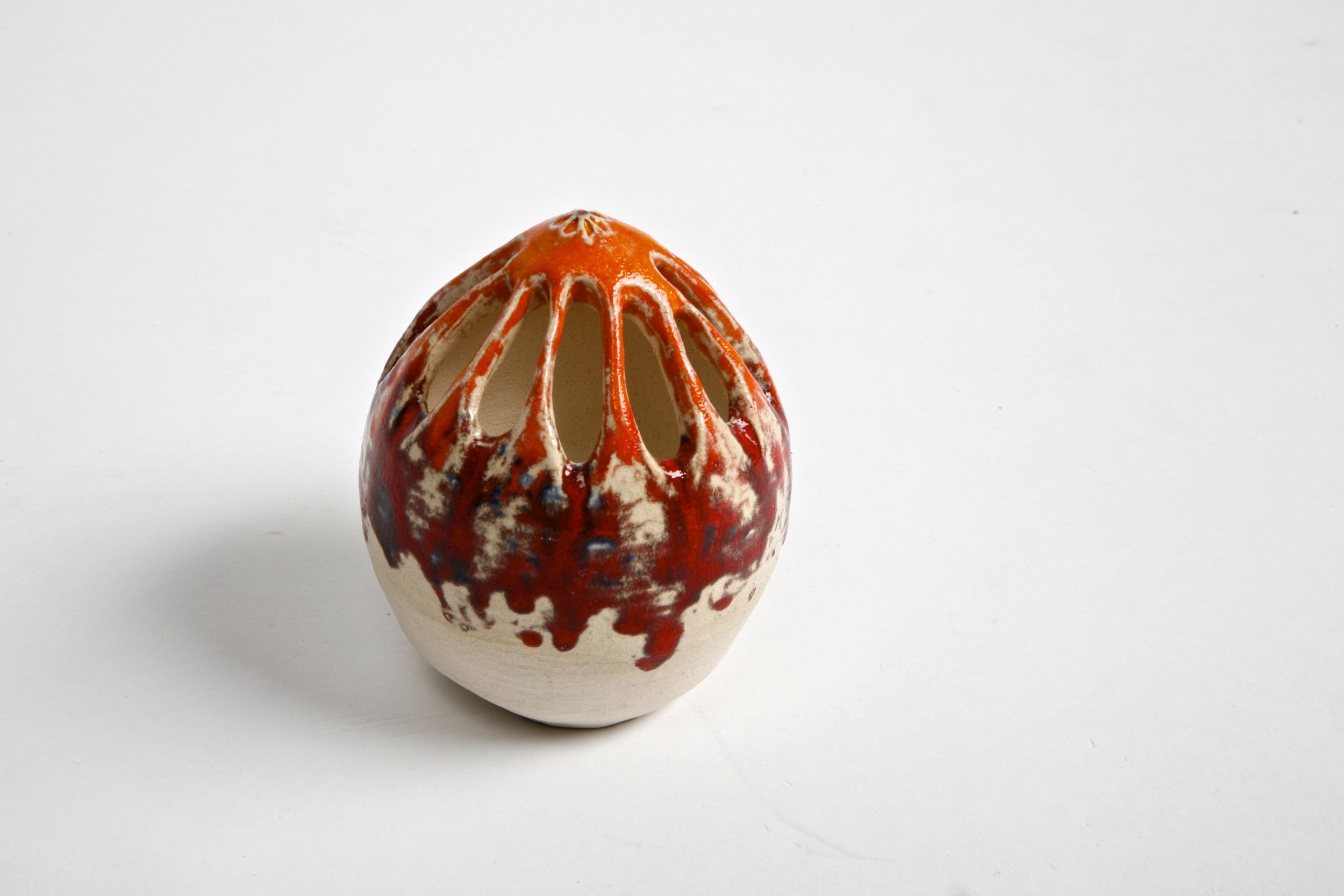 Red and orange colored ceramic egg like sculpture at NCAD Dublin IR Shannon May Mackenzie