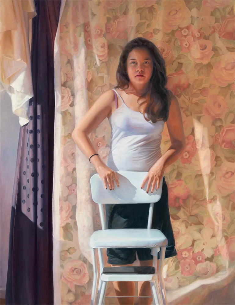 Olivia Standing Behind White Chair