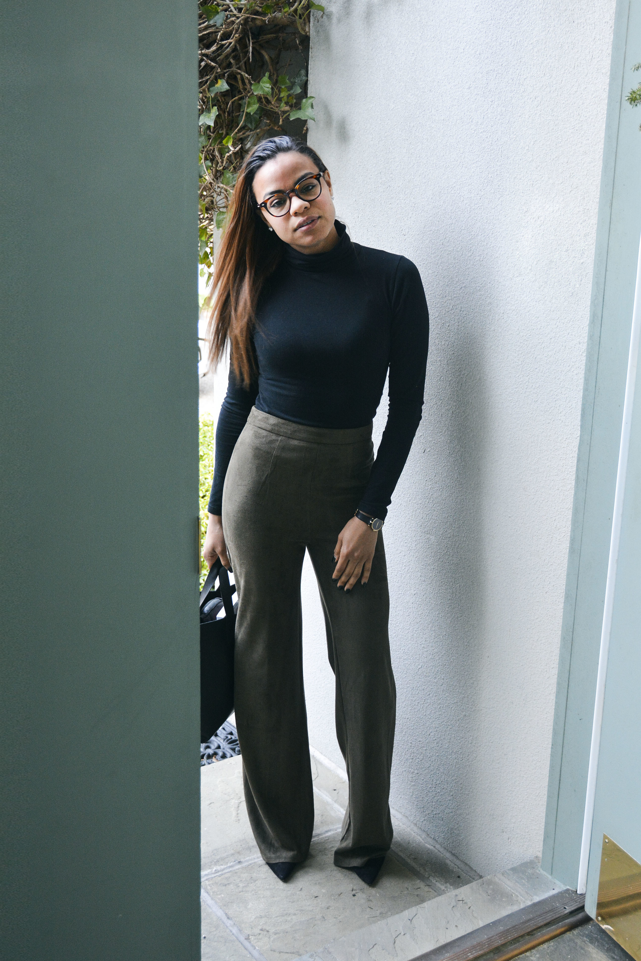 wearing: Urban Sweetheart Pants, American Apparel turtleneck, ALDO shoes, custom leather bag, vintage Gucci watch, Marc Jacobs eyeglasses