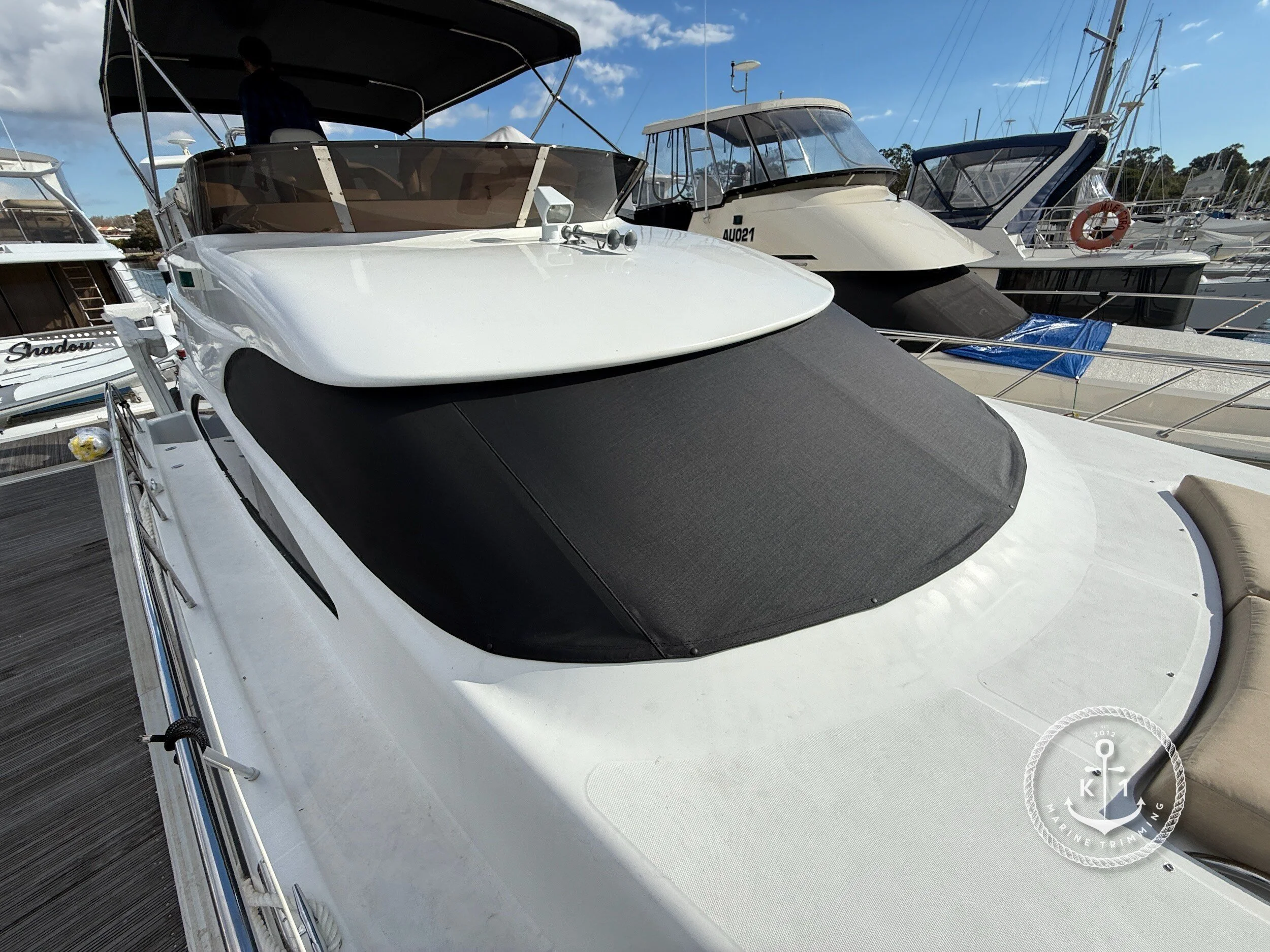 Make: Dyna Model: 48 Flybridge Products: Window Cover, Day Bed Upholstery, Material: 2x2 Mesh (black), Sunbrella Acrylic Canvas (Tresco Linen), Window covers protect your boat’s interior from UV rays and heat while preserving privacy and reduc