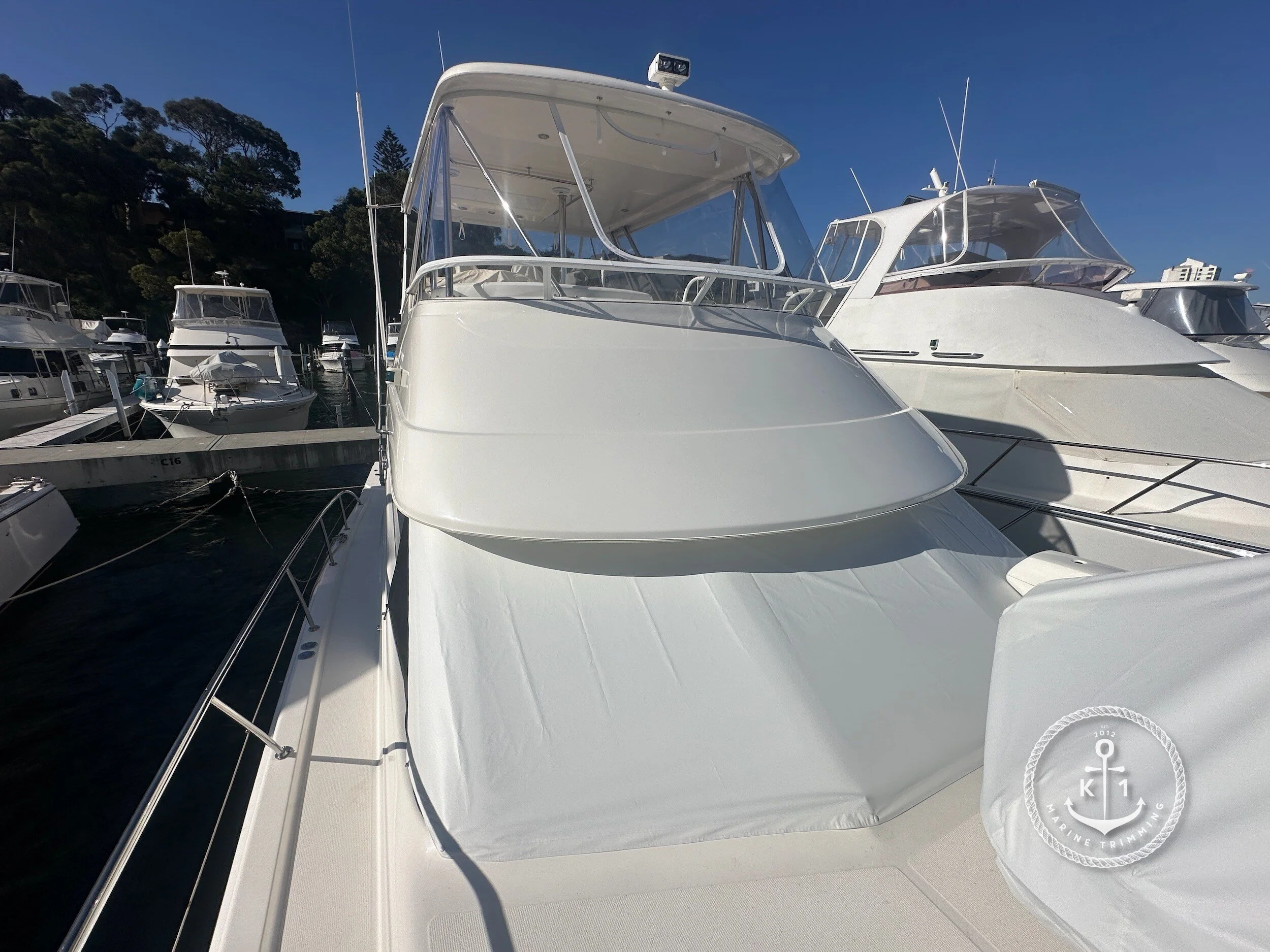 Make: Riviera Model: 51 Flybridge Products: Flybridge Clears, Window Cover Material: Strataglass, Stamoid Top (White) Flybridge clears provide all-weather protection and enhanced visibility for your flybridge, ensuring comfort, safety, and style