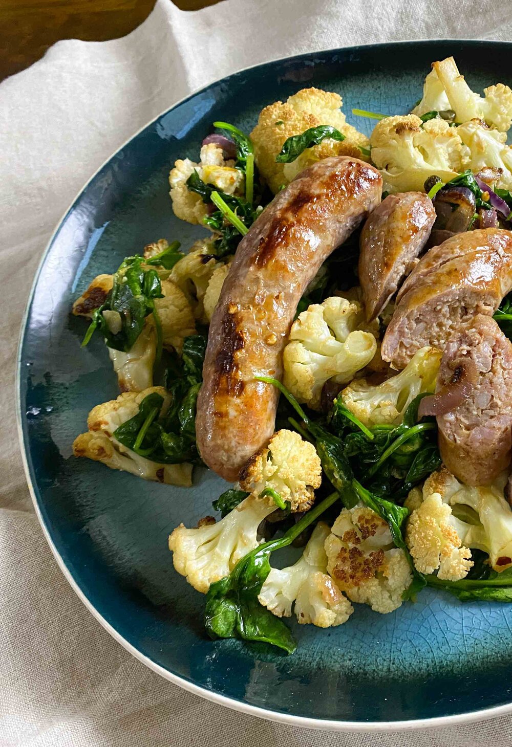 Italian Sausages with Roasted Cauliflower and Greens