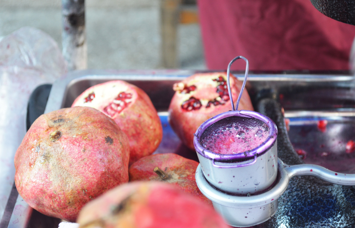 Freshly squeezed pomegranate juice on the side of the road