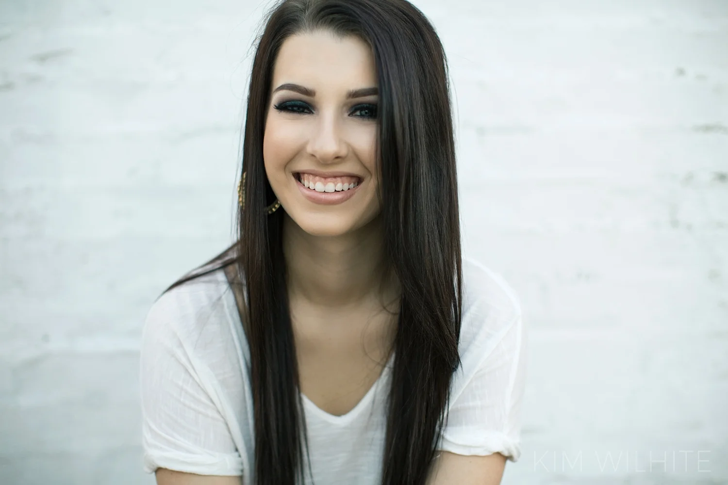 West Monroe High School Senior smiling photos located in Downtown Monroe.