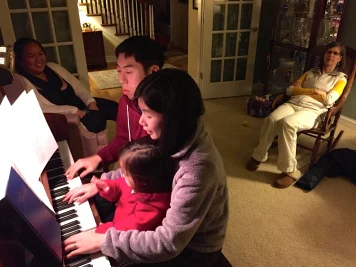 Playing piano with a little help from our niece :) 