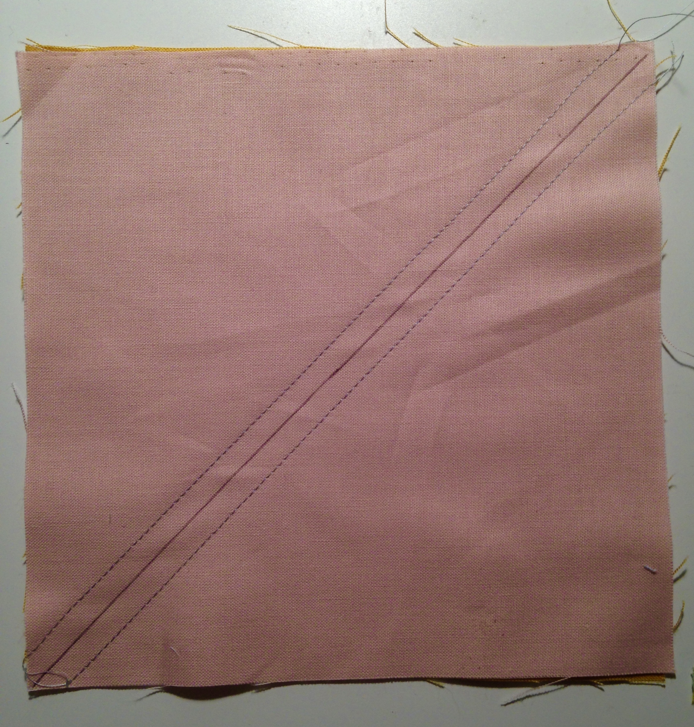  2. Sew 1/4" away from the drawn line on each side. 