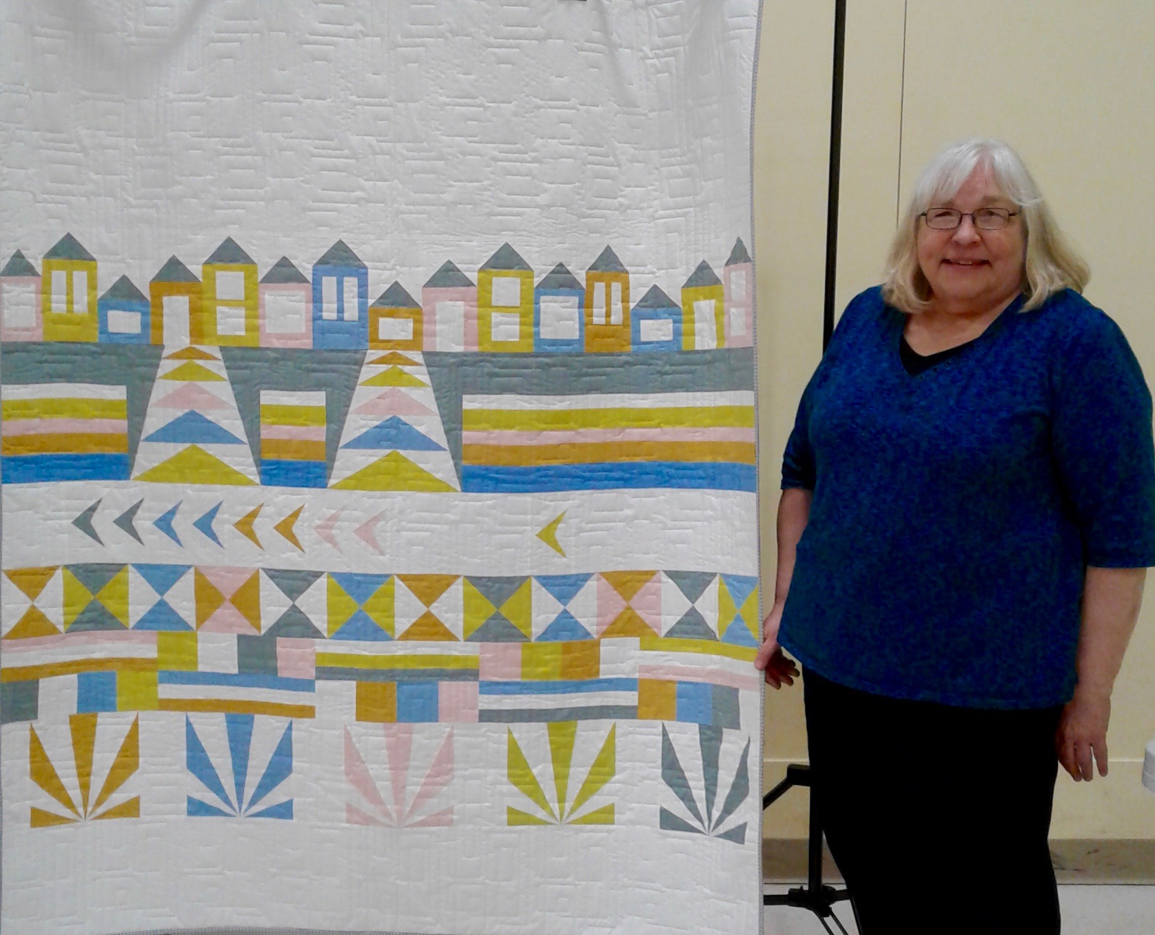 Chris Carlson with her Row by Row quilt