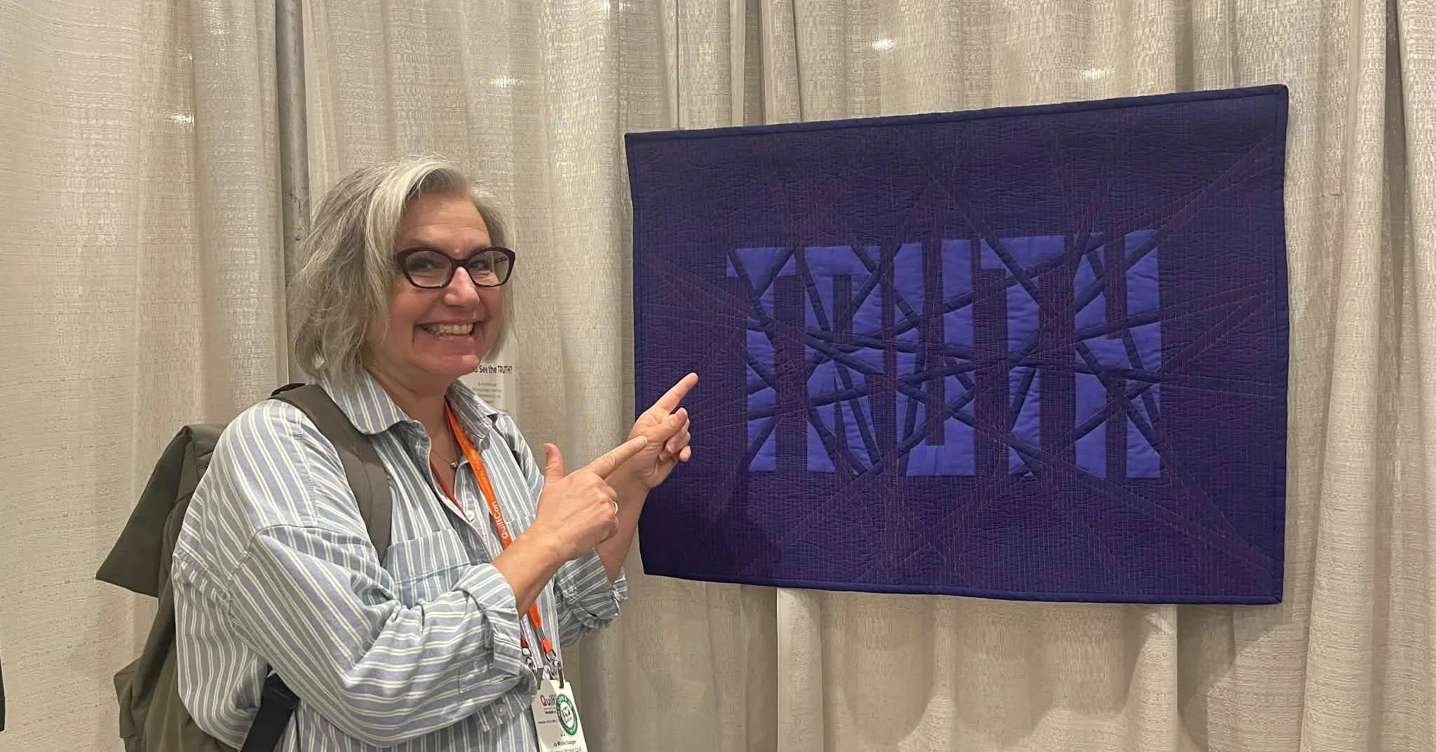 ✨ FOUR quilts for PMQG Member, Jo Wollschlaegar, at QuiltCon 2026! ✨

Artist: Jo Wollschlaeger
Instagram: @jowoquilts

What an incredible showing this year &mdash; and one ribbon to top it off! 🩵

🧵 Quilt #1: Can You See the TRUTH?

This powerful p