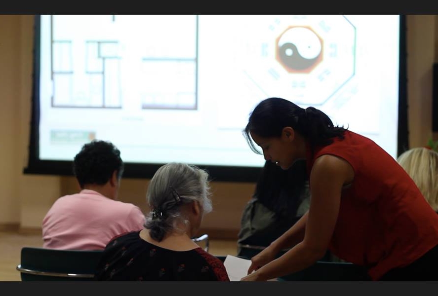 feng shui expert laura cerrano helping student at workshop.jpg