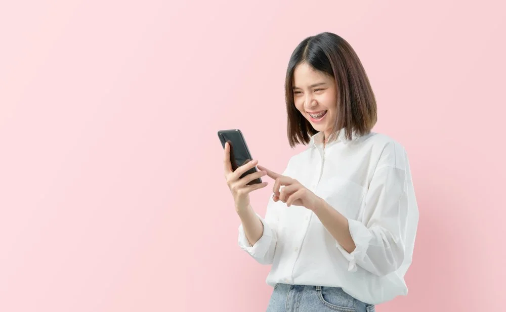 Teen Asian Female Investor on Cell