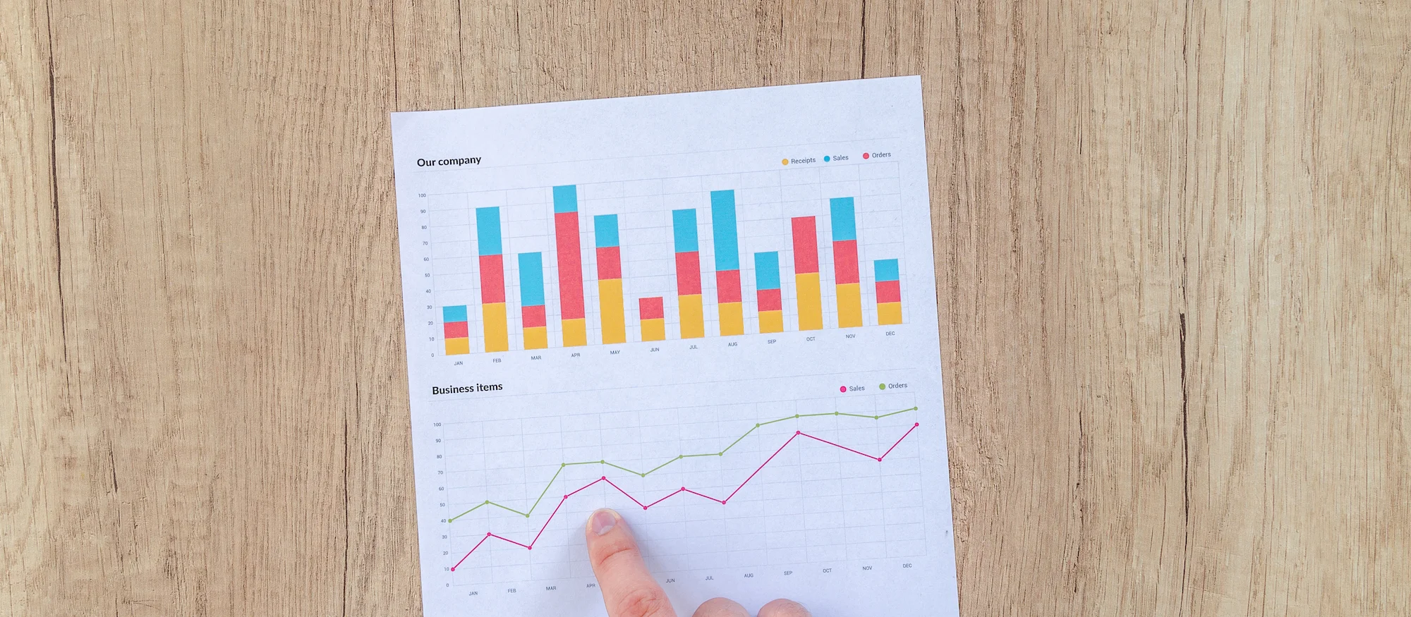 Canva - Man Showing Business Graph on Wood Table (1).jpg