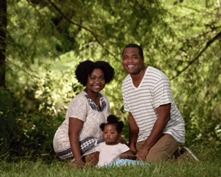 Nancy and Benjamin with their daughter Amaris, born last year. 