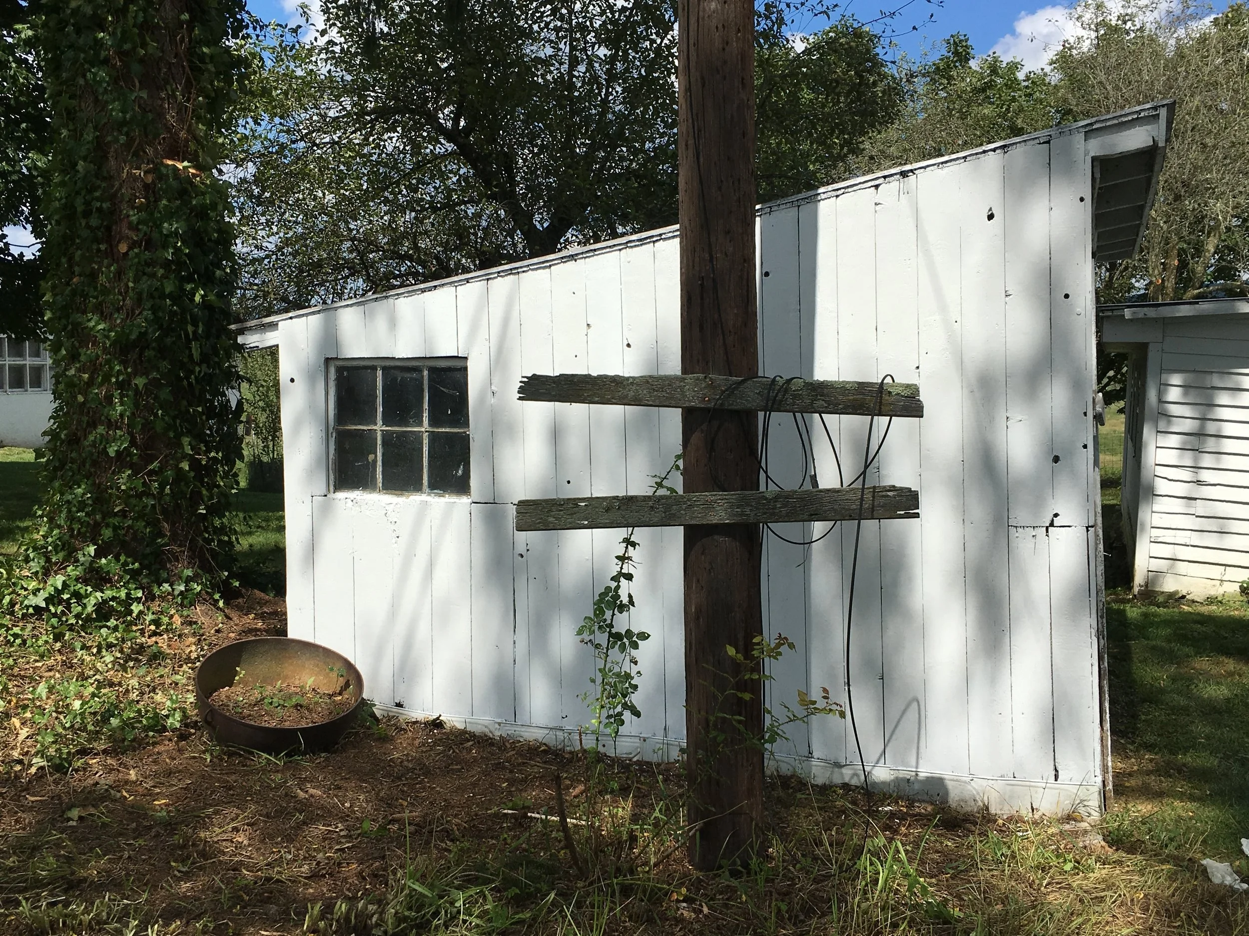 One of two remaining small turkey brooder houses