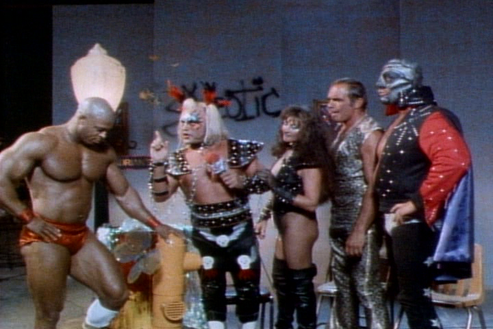PLENTY OF HIGH KITSCH FACTOR FROM THE CAST. FROM LEFT TO RIGHT: CAPTAIN CARNAGE (BILL GRANT), EXOTIC ADRIAN STREET, STREET'S VALET (AND REAL LIFE WIFE) MISS LINDA, GOLDEN GREEK JOHN TOLOS AND THE MASK
