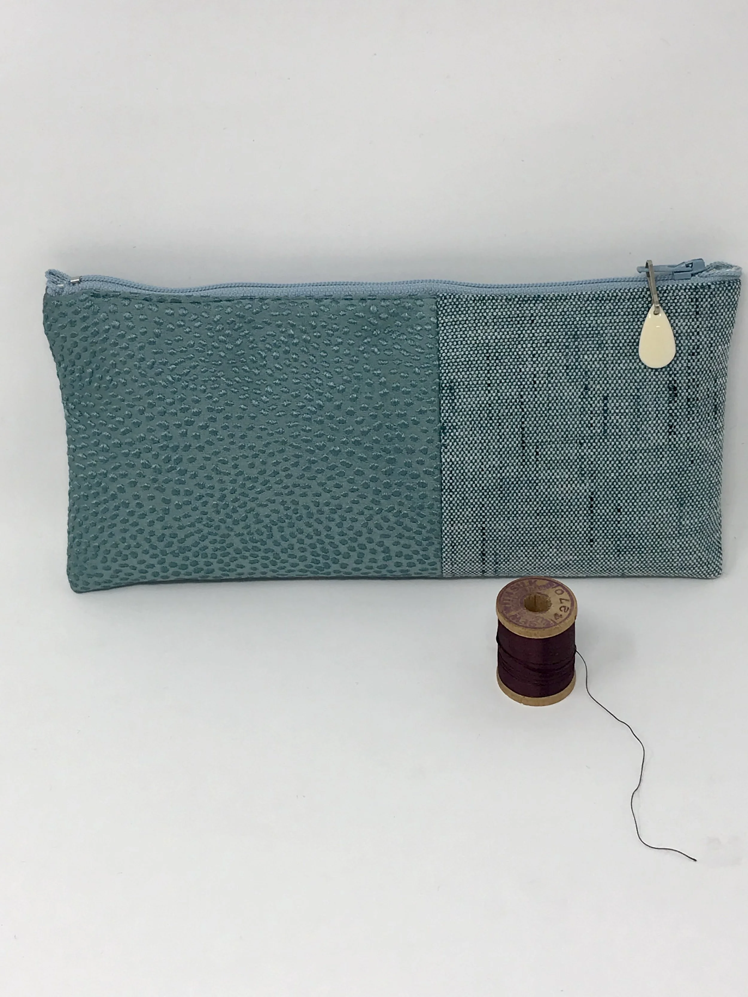 clutch pebble teal.jpg