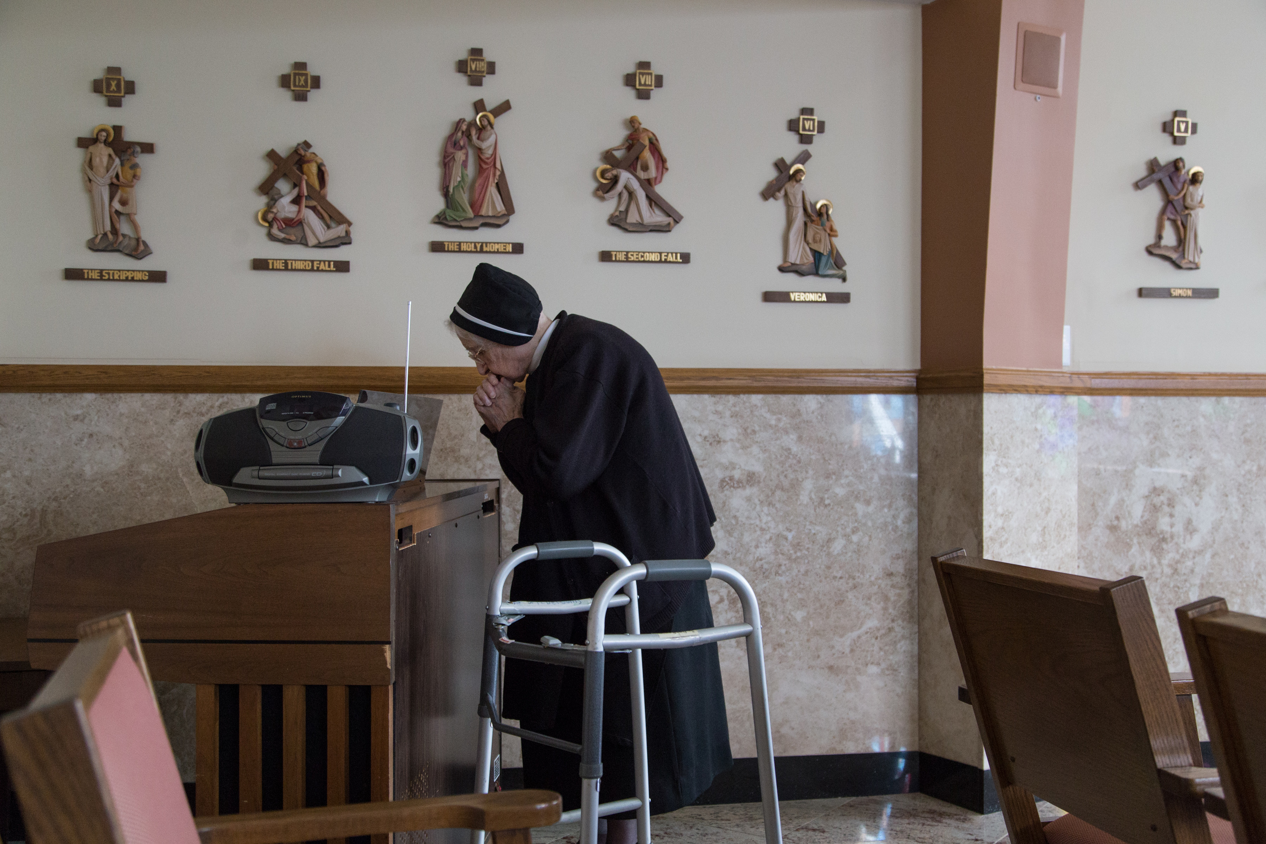  One of the oldest living Filippini Sisters, at 103, prays in the chapel. 