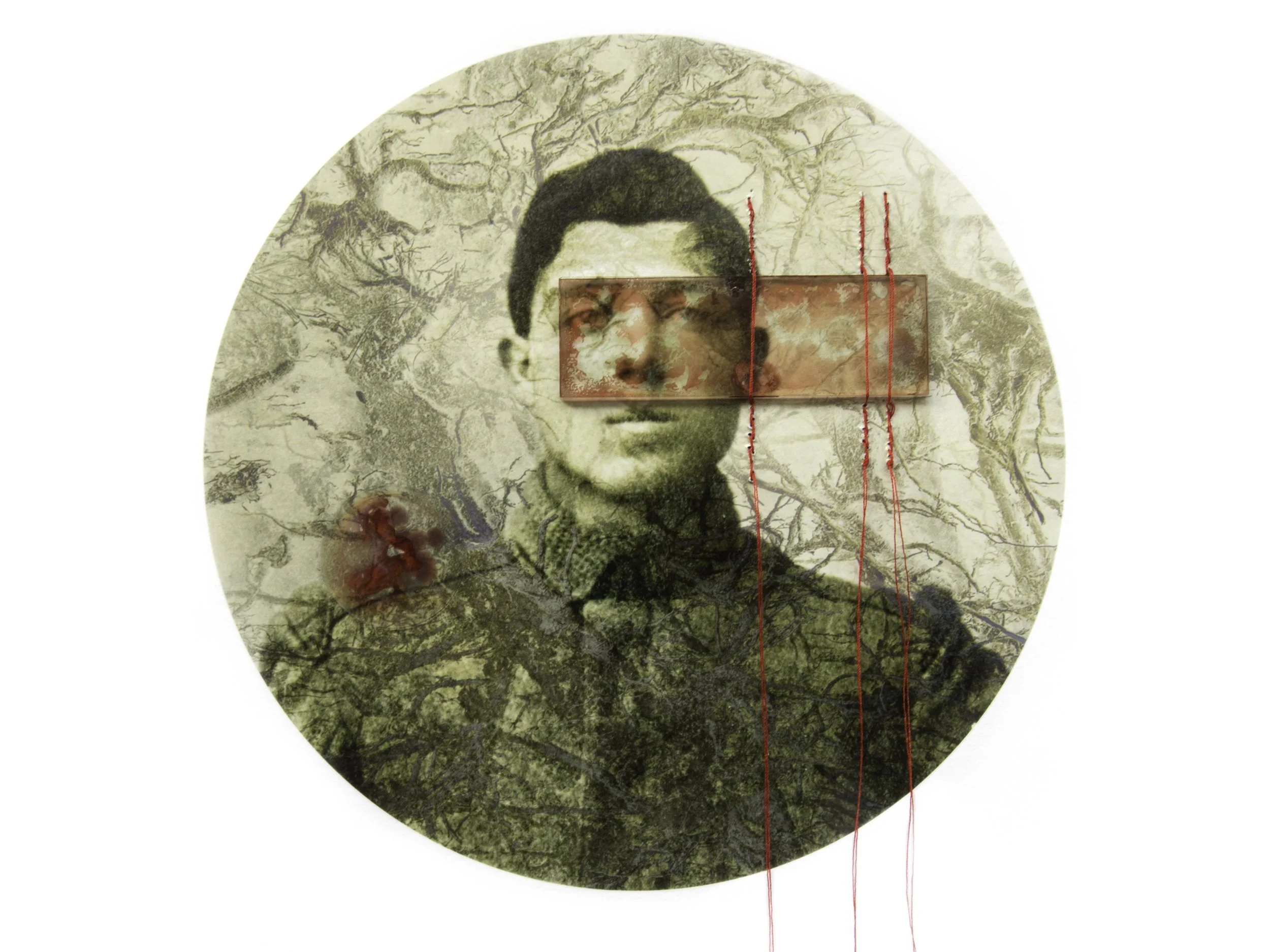 Abstract circular artwork featuring a black and white portrait of a young man with glasses, overlaid with a tree branch pattern, red embroidery lines, and textured elements.