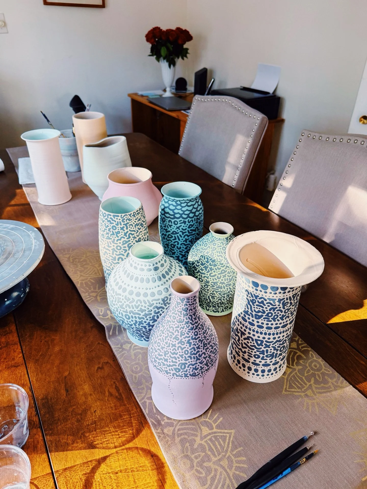 Had a productive weekend: 6 vases glazed and ready for firing. I have 4 more in this batch before that happens. Meanwhile another dozen are going into the bisque, but porcelain (these are stoneware). Hoping the kiln gods favor us and everything comes