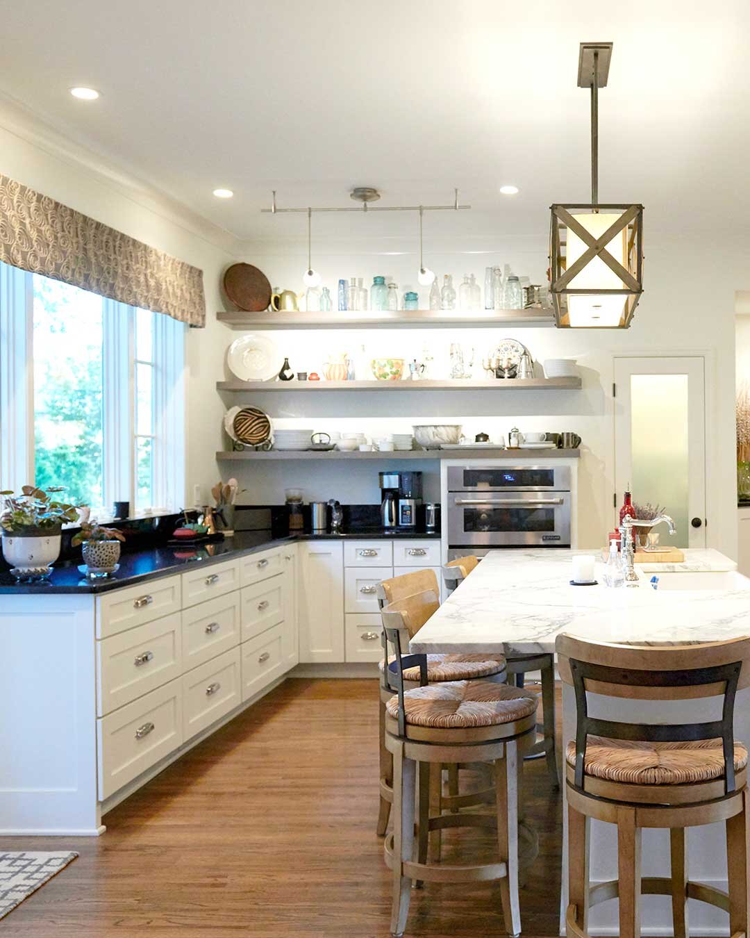 Grey-wood-shelves-open-floor-plan-large-marble-island.jpg