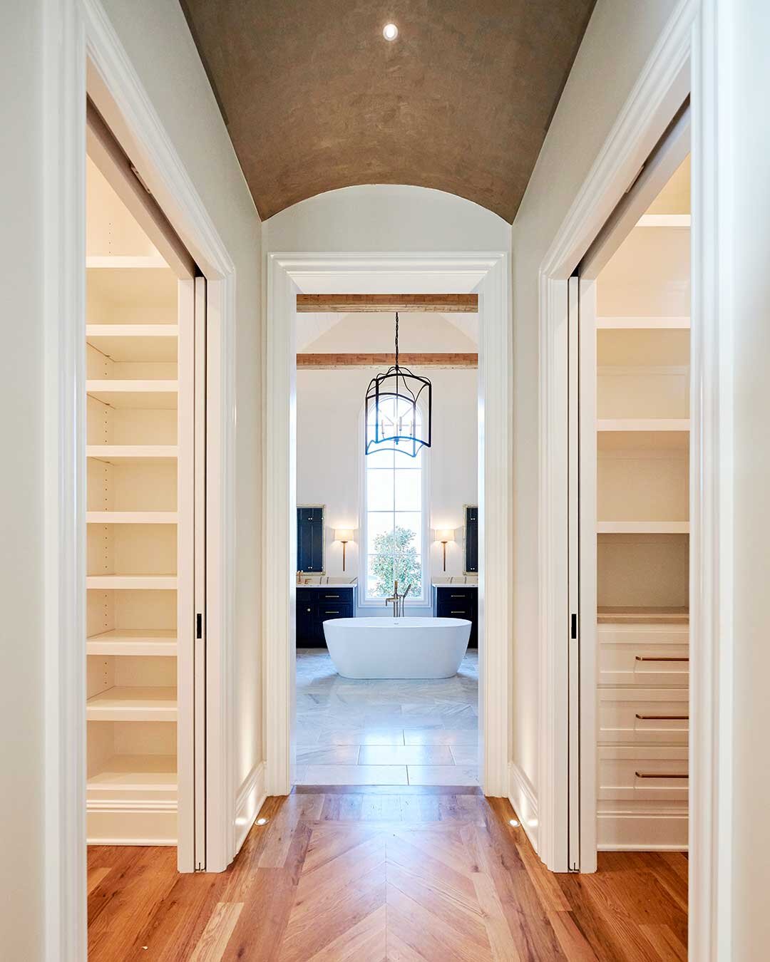 Arched-hall-His-n-her-closets.jpg