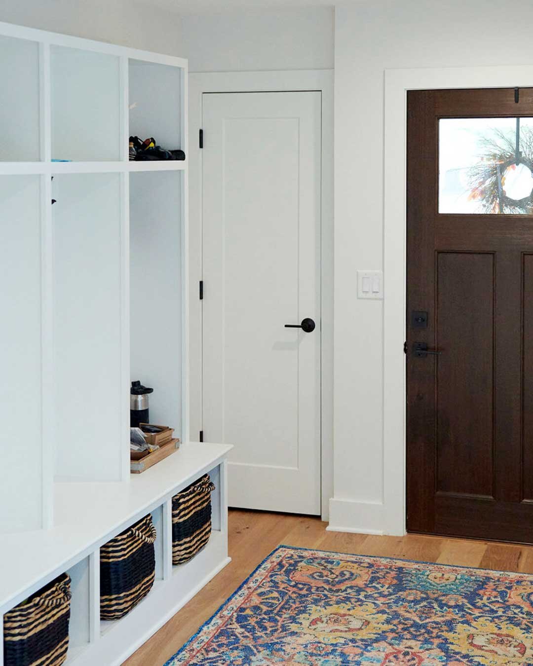 white-mudbench-red-rug-wood-door.jpg