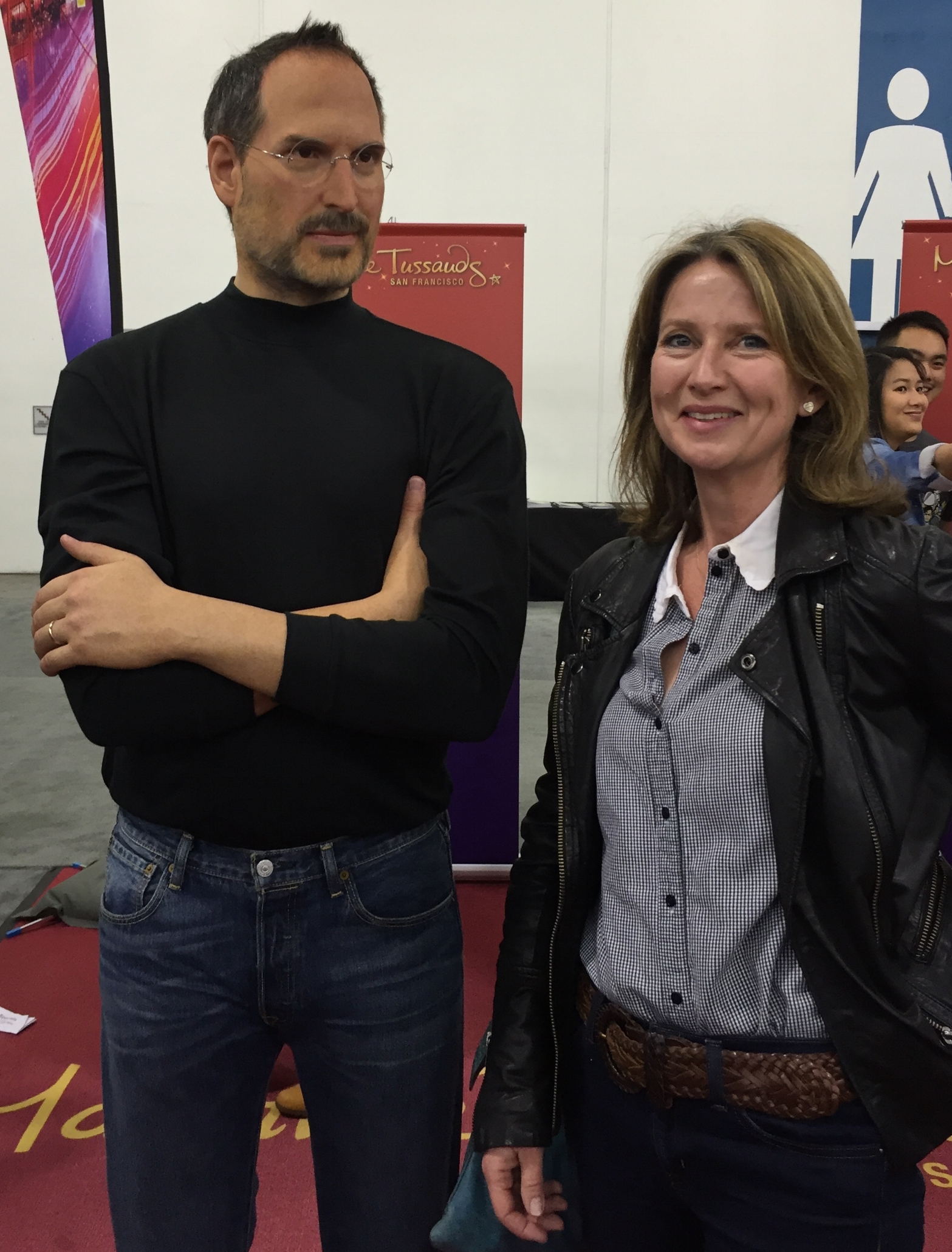 TinkerTech Founder and blog author Claire Comins sharing a joke with a waxwork Steve Jobs. At ComiCon Silicon Valley