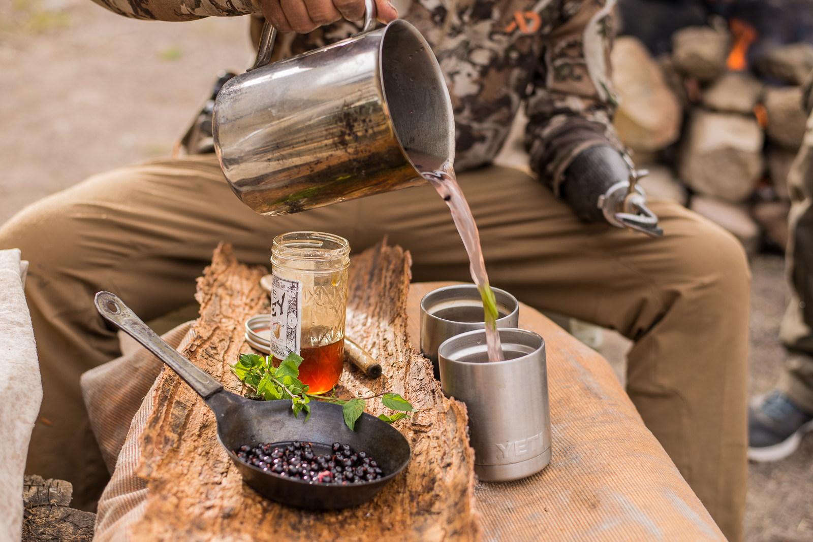 making a wild foraged blackcurrant and moonshine hot toddy at 10,000ft in the montana mountains. PHOTO: YOGESH SIMPSON