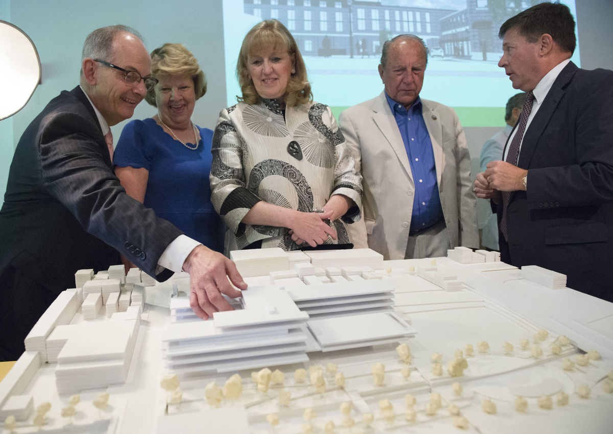  Staff photo by Graham Cullen From left, Frederick Mayor Randy McClement, state Delegate Carol Krimm, County Executive Jan Gardner, County Council President Bud Otis and Peter Plamondon Jr., CEO of Plamondon Hospitality Partners, mingle after unveiling of a model of the proposed downtown hotel and conference center on Thursday at the Delaplaine Visual Arts Education Center. 