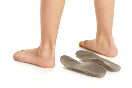 99780730_S_teenager_child_severs_disease_heel_pain_orthotics_standing_feet.jpg