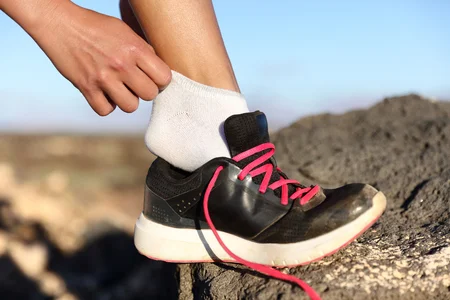 55645917_S_hiker_socks_changing_sneaker_runner_mountain_outside_jogger.jpg