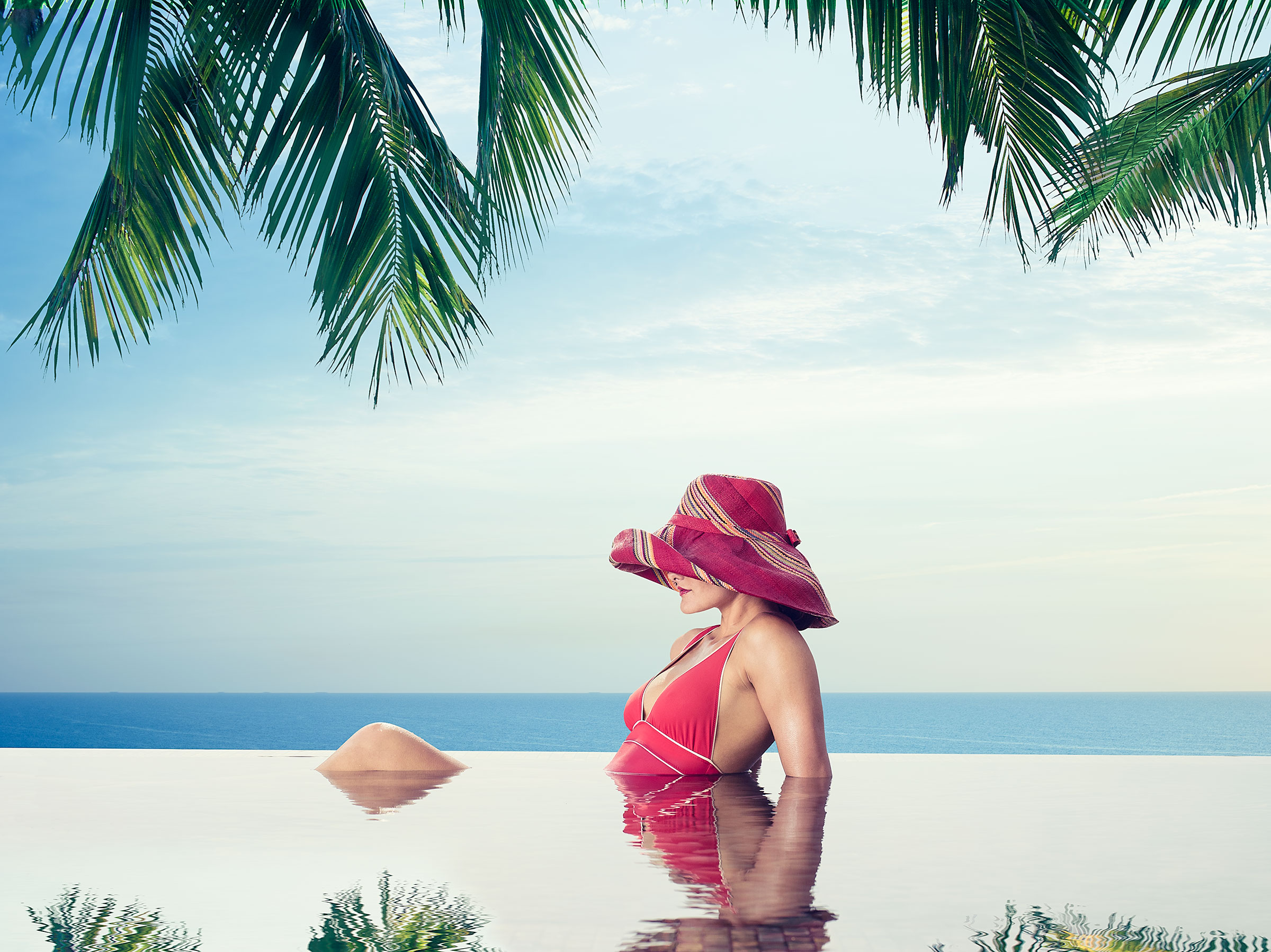 And of course we had to photograph an infinity pool. Couple that with palm trees, the ocean, and an elegant bathing suit and sun hat, and the image screams Amelia Island.