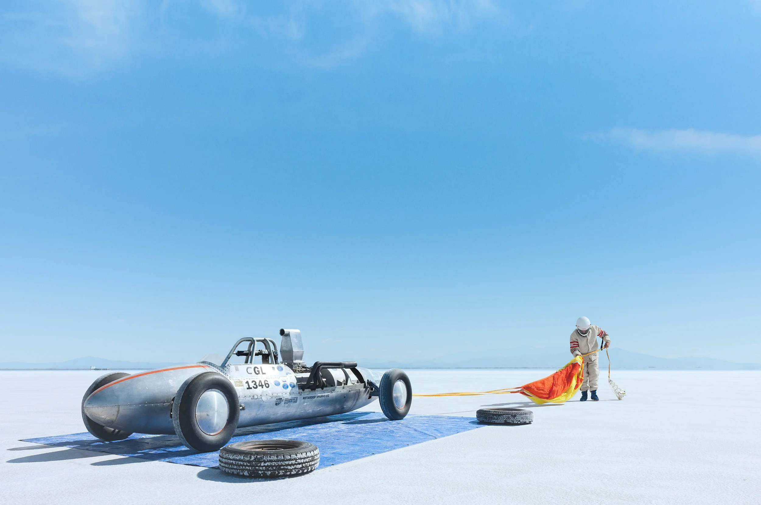 Of all the crazy cool, held-together-with-gobs-of-spit-and-prayer contraptions I’ve had the pleasure of photographing during Speed Week at Bonneville Salt Flats, the belly tankers are my favorite. I think if Dr. Frankenstein were into car racing, these are the speed monsters he would have created. In their first life these belly tankers - or lakesters as they’re often called - were fuel tanks on World War II fighter planes. After the war, however, with hundreds of these fighters mothballed, resourceful hot-rodders - noting the aerodynamic potential of these fighters’ fuel tanks - cut them in half and welded two lower-portions together, creating these utterly unique open-wheeled land torpedoes. The P-38 Lightening’s fuel tanks were a particular favorite, being perfectly sized for an engine and drivetrain. The ingenuity and madness it took to make these beautiful Frankensteins makes me smile. Fantastic stuff.