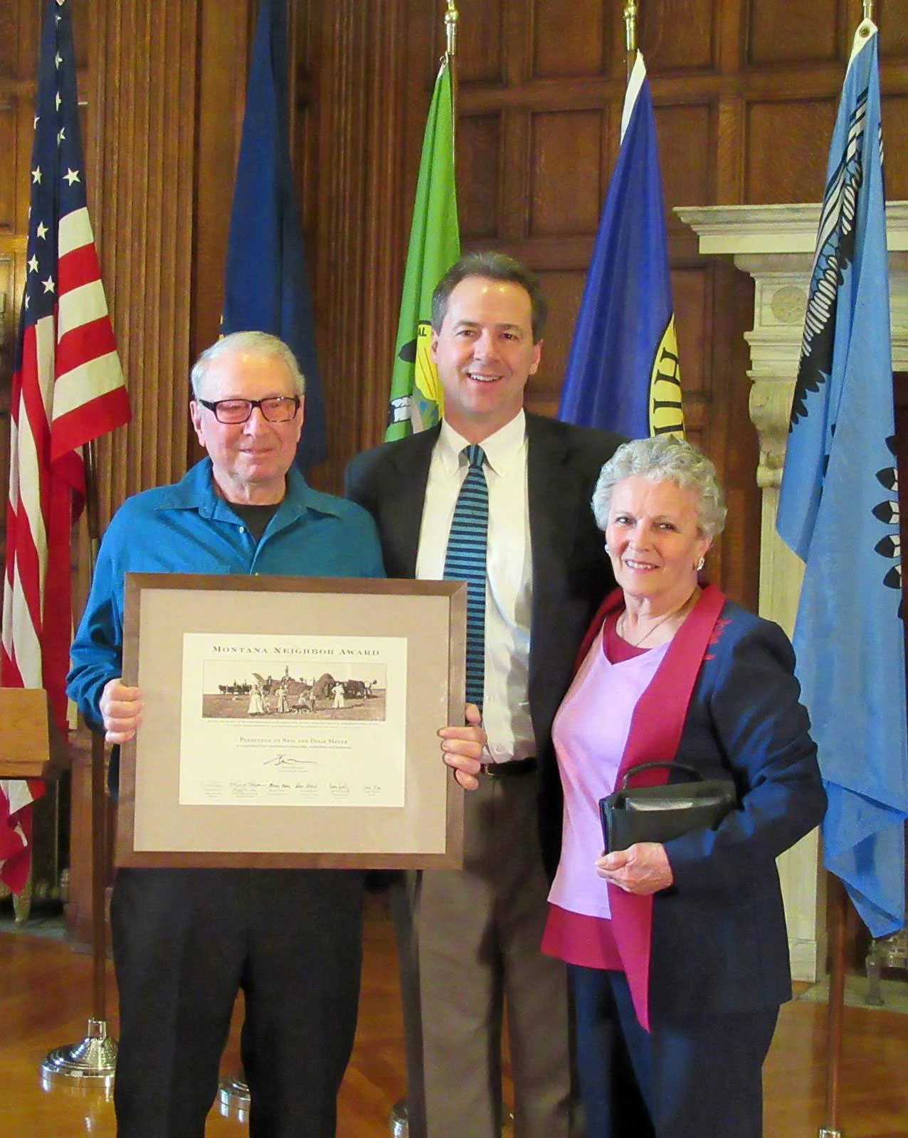 Neil Meyer, Montana Governor Steve Bullock, and Dixie Meyer