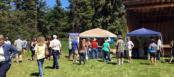 Community members visiting with vendors