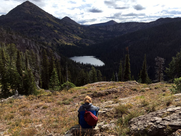 Evan admiring Upper Holland lake from above. Upper Holland is a “ tarn” – a mountain lake occupying a theater-shaped valley excavated by a glacier.