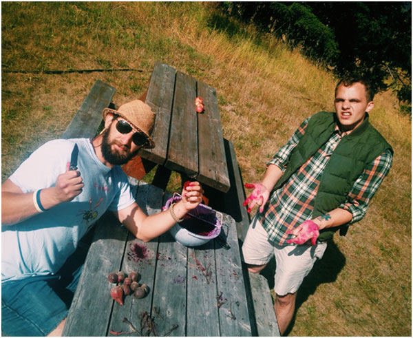 Riley and Henry shredding beets for beet cake and beet brownies