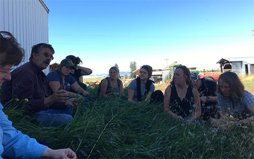 Sitting in the cool grass, out of the sun and away from the noisy potato harvesting equipment, we get some time to speak with Jack and Susan together.