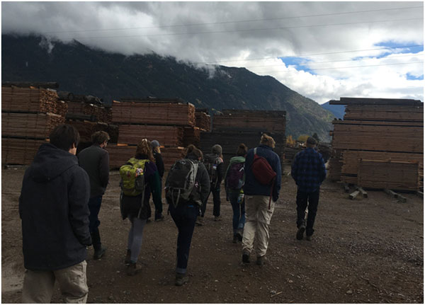 A dusting of snow falls while we tour the lumberyard with Ben and Roy