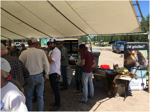 Participants visiting with SVBR staff and vendors at the Bear Fair