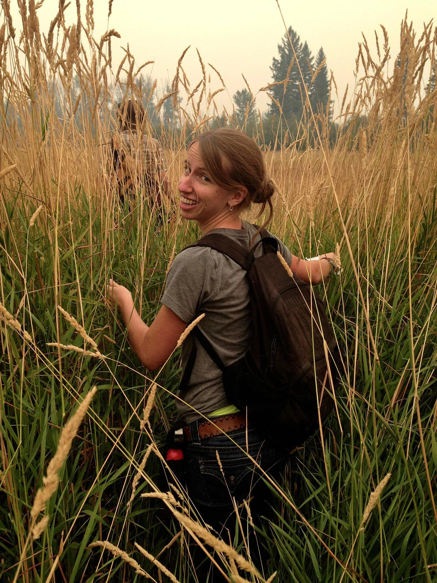 Anna wading through the reed canary grass on our way to the river for the first day of Watershed Dynamics