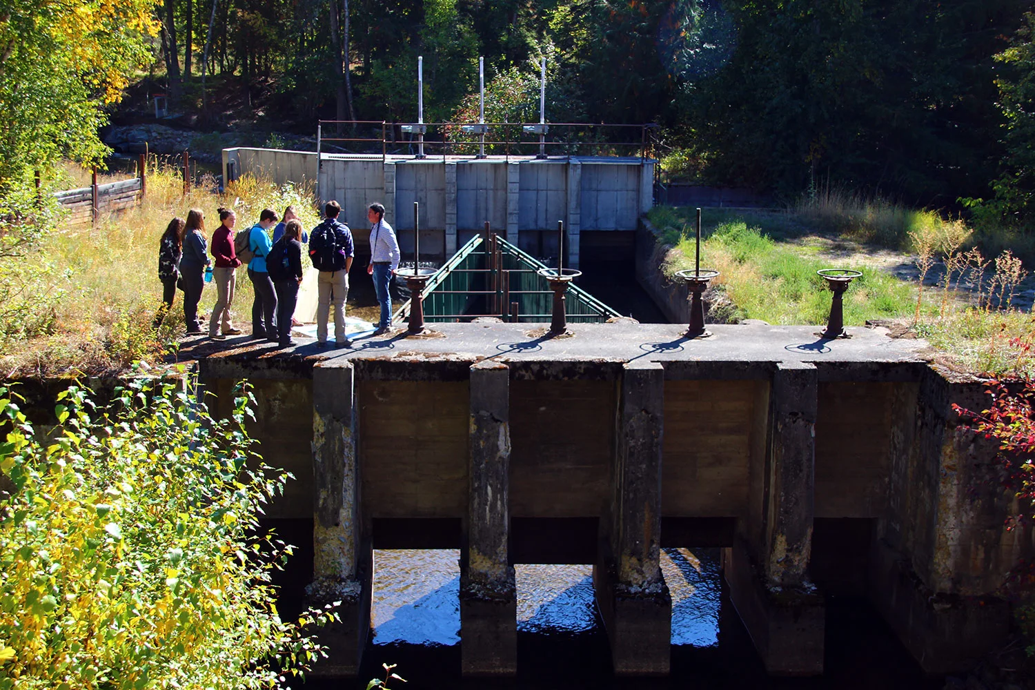 Casey, the Tribal Hydrologist, talking with us about the Flathead Indian Irrigation Project atop a huge head-gate.