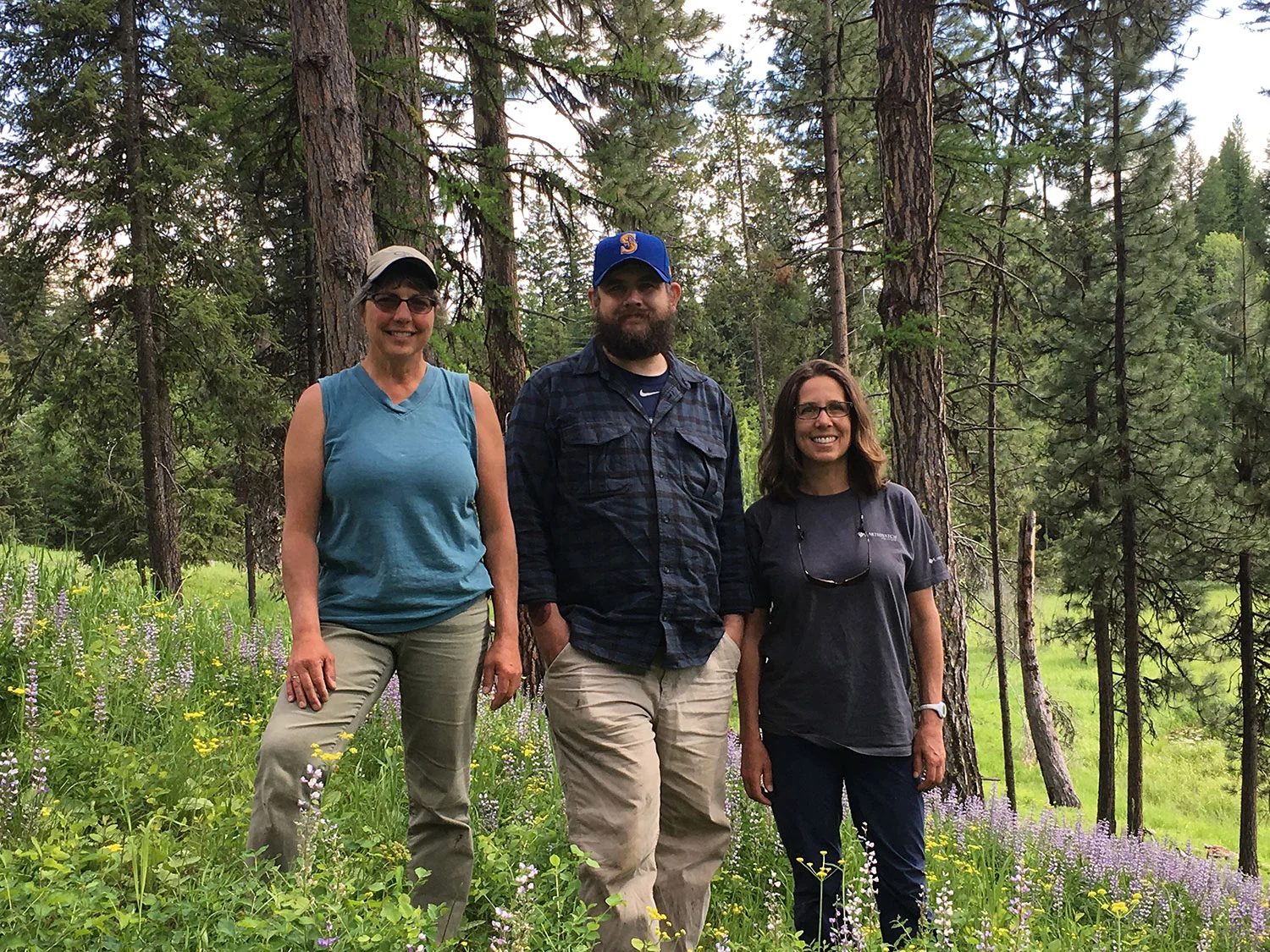 Principal Investigator Maria Mantas with volunteers Kyle Stoddard and Hannah Webber, standing on a lupine-filled slope behind the Old Condon Ranger Station, which provides an awesome lodging opportunity that some of this year’s volunteer teams will enjoy. Photo: Rob Rich