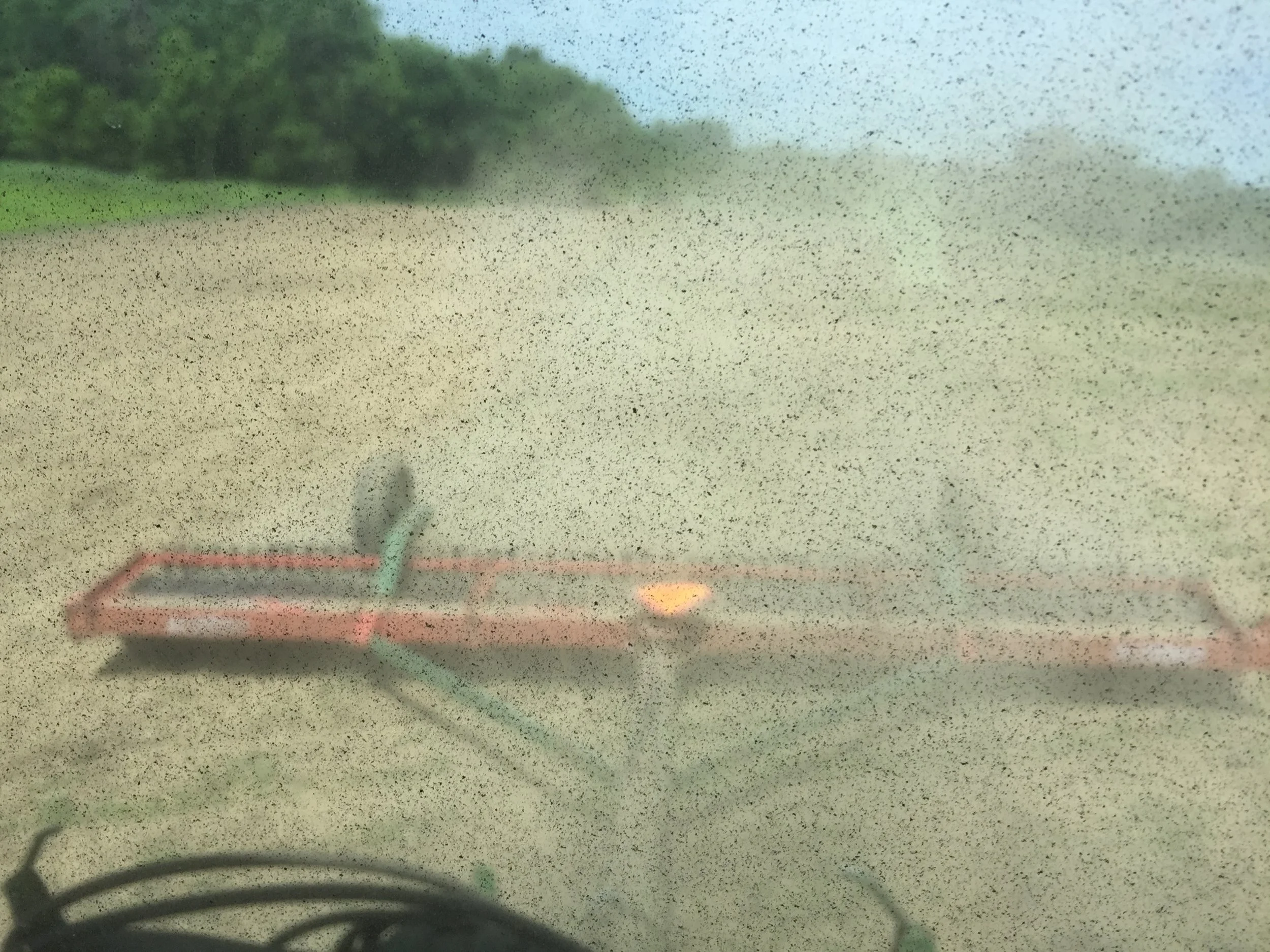 View of the cultipacker through the tractor rear window. 