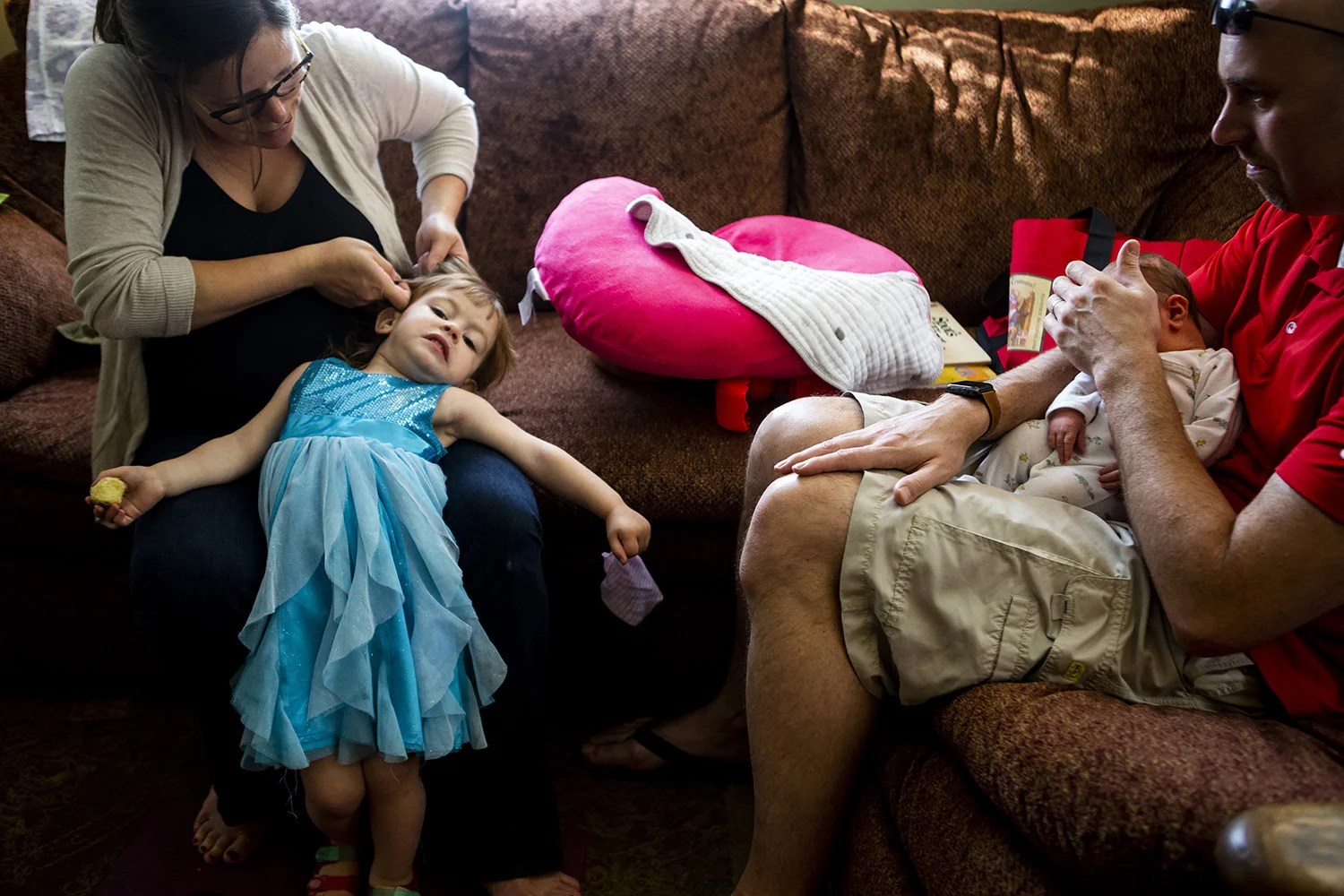 Portrait of family life with a newborn and a toddler.
