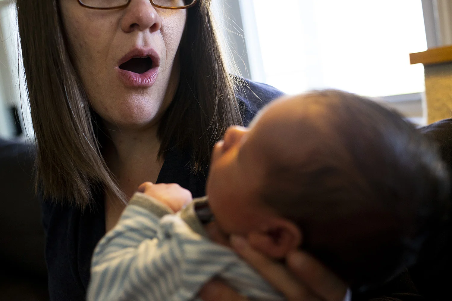 Boston mom exclaims in wonder at her newborn baby.