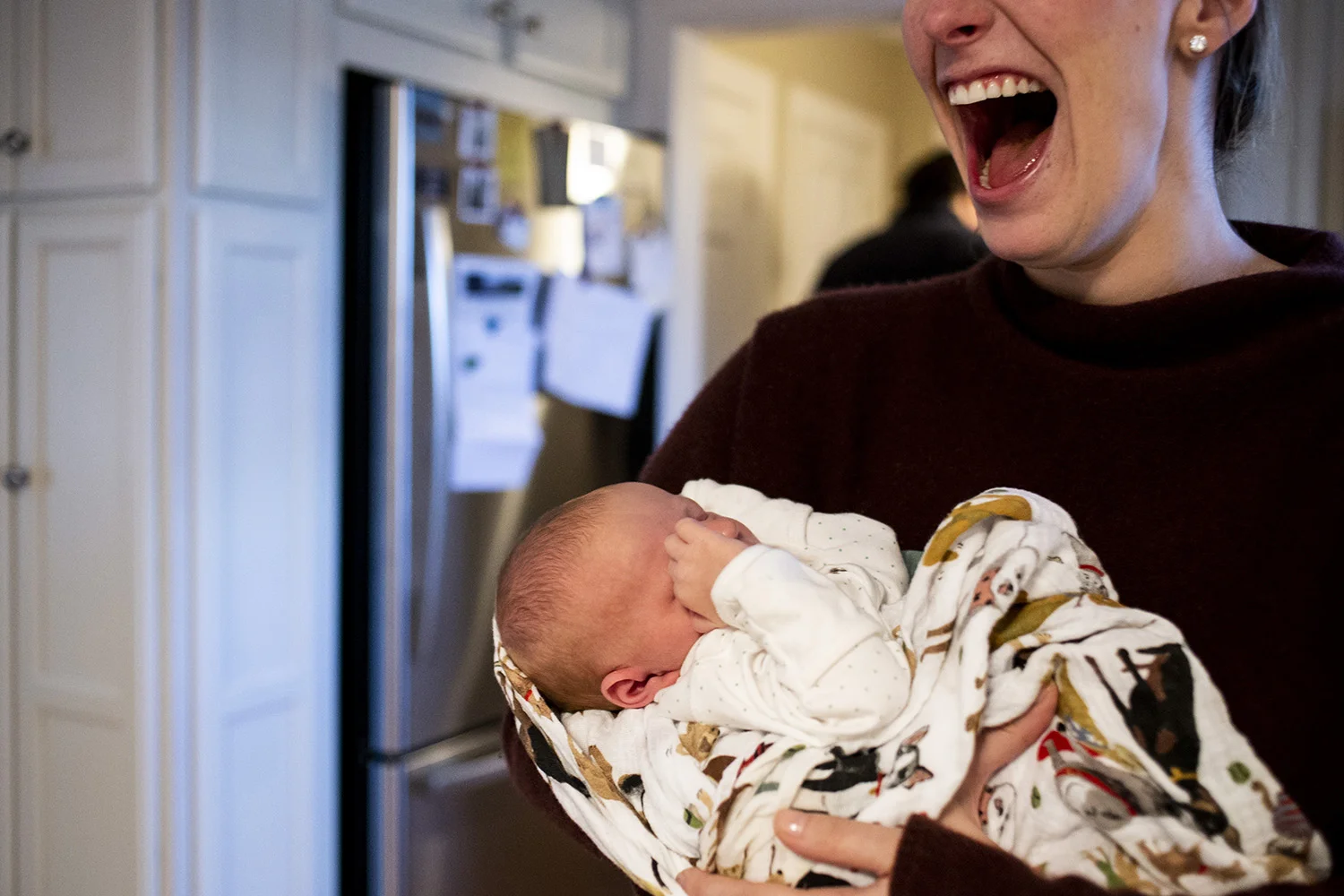 Joyful portrait of newborn motherhood in Boston Massachusetts.