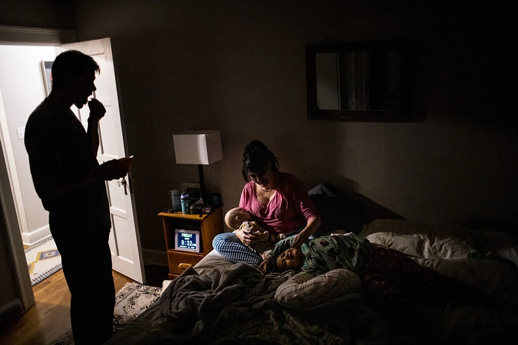 Heartfelt photo of boston family life with a new baby.