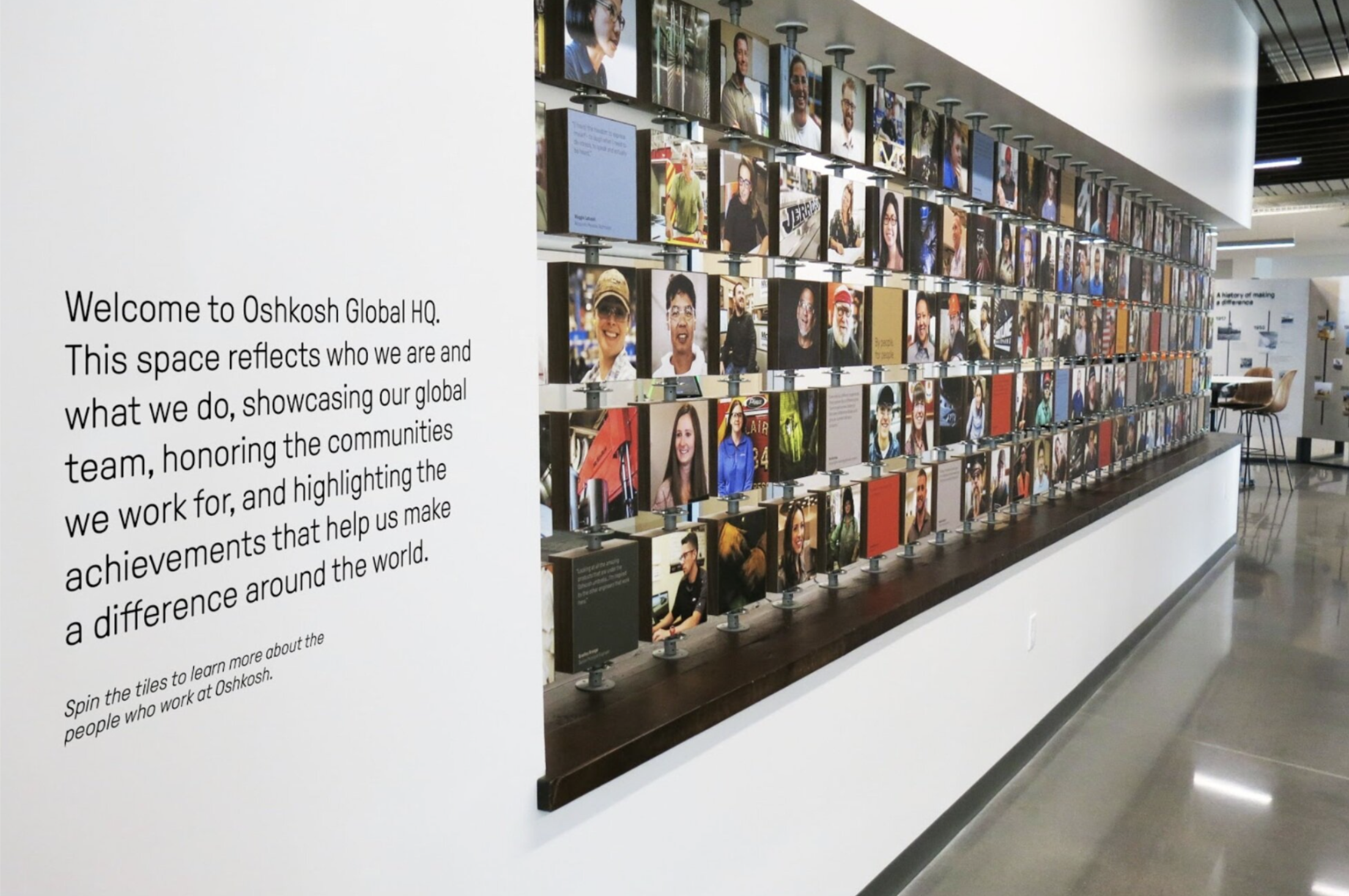 Oshkosh Headquarters → rotating tile people wall